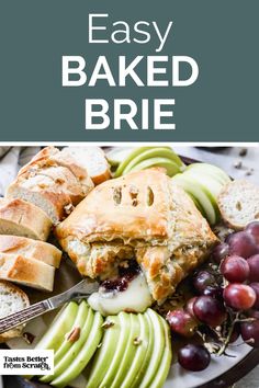 an easy baked brie on a plate with grapes and apples