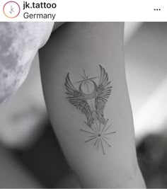 a woman's arm with a tattoo on it and an arrow in the middle