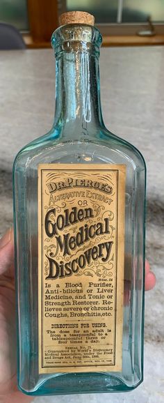 Antique Dr. Pierce's Golden Medical Discovery Bottle w/Label Buffalo New York!! * Rare example in excellent condition and with the original label!! * Antique turn of the century * Quack Medicine - the very reason we have a current day, FDA * No chips or cracks here * Bottle is bright, shiny, and clean! * Newer, replacement, cork. * Bottle is approximately 8.5 T For the cure of all severe, chronic or lingering coughs, bronchitis, laryngitis, weak lungs, bleeding from lungs, public speak Discovery Bottles, Cork Bottle, Chronic Cough, Buffalo New York, Sore Throat, Glass Bottles, 19th Century, Buffalo