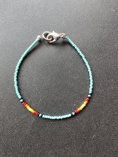 This simple beaded bracelet is a colorful addition to your breezy summer wardrobe. You'll want to wear this as you head out the door to your summer events. These bracelets are 7inches and have a lobster clasp for a great fit! I have 6 to offer so, you'll want to order now to ensure that this design is yours in time for your next event. Turquoise Friendship Bracelets With Colorful Beads, Casual Turquoise Beaded Bracelets With Tiny Beads, Hand-strung Turquoise Beaded Bracelets For Summer, Bohemian Beaded Bracelets With Lobster Clasp For Festivals, Hand-strung Beaded Bracelets For Everyday Summer, Colorful Beaded Bracelets For Everyday Summer Wear, Summer Hand-strung Beaded Bracelets, Everyday Summer Beaded Bracelets, Adjustable Beaded Bracelet With Lobster Clasp For Festival