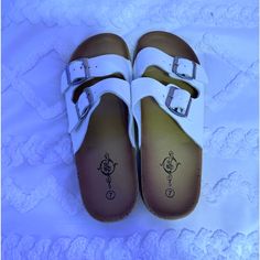 Size 7 Women’s Cute And Comfy - Perfect Condition Never Worn White Casual Flip Flops With Flat Heel, Casual White Flip Flops, White Synthetic Footbed Sandals With Buckle Closure, White Synthetic Footbed Sandals, Comfortable White Synthetic Footbed Sandals, Comfortable White Slip-on Sandals, White Flip Flops With Textured Footbed For Beach, Comfortable White Sandals With Cork-bed Midsoles, White Textured Footbed Flip Flops For Vacation