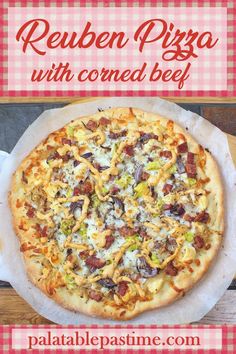 a pizza sitting on top of a pan covered in cheese and toppings with the words reuben pizza with corned beef