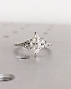 an engagement ring with three pear shaped diamonds