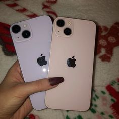 two iphones are shown in the same color as one is pink, and the other is white