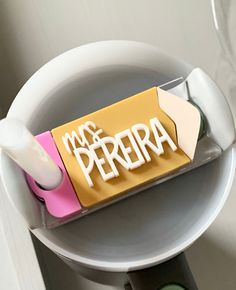 a toothbrush holder with the word mr and mrs peria in white letters on it