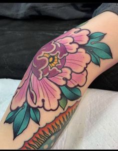 a person with a flower tattoo on their arm