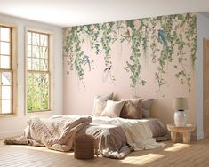 a bedroom with pink walls and wooden floors