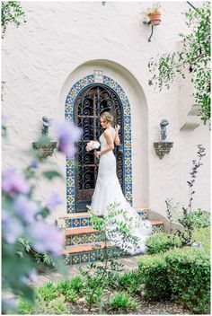 a woman in a wedding dress standing on steps