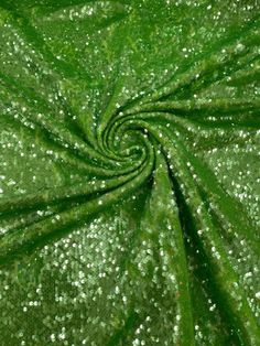 green and white sequins on fabric