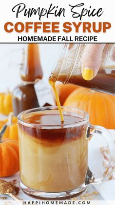 pumpkin spice coffee syrup is being poured into a glass mug filled with homemade fall recipe