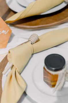 the napkins are tied on top of each other and ready to be used as place settings