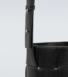 Find BOTTEGA VENETA Cassette Lantern Leather Bucket Bag on Editorialist. The Bottega Veneta Cassette Lantern leather bucket bag is crafted from lamb leather with a lamb leather lining. The bag features an open top, adjustable shoulder straps, and a drawstring closure. It includes a dust bag. Made in Italy. Bottega Veneta Cassette, Leather Bucket Bag, Grid Pattern, Leather Bucket, Open Top, Bottega Veneta, Bucket Bag, Black Silver, Lanterns