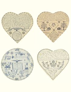 four heart shaped plates with different designs on them