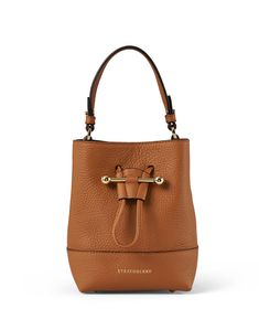 The Lana bucket bag is casual, chic and functional, making it perfect for everyday wear. The bucket silhouette is cut from premium leather, closes with a drawstring closure, and features a detachable crossbody strap for easier wear. Style it with easygoing dresses and sleek separates to instantly elevate any look. Luxury Brown Bucket Bag With Zipper Closure, Luxury Rectangular Bucket Bag With Snap Closure, Luxury Vintage Brown Bucket Bag, Luxury Brown Bucket Shaped Bag, On-the-go Bucket Bag With Gold-tone Hardware, Luxury Everyday Bucket Bag With Adjustable Strap, Luxury Bucket Bag With Adjustable Strap For Everyday, Modern Bucket Bag With Gold-tone Hardware, Modern Pouch Bucket Bag With Gold-tone Hardware