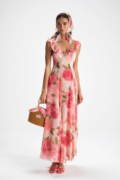 Adorn yourself in floral this season. The Evie Dress is rich, layered, and gorgeous from head to toe. The long skirt adds length and the square neck adds grace to your feminine figure. Pair it with the head scarf for a main character moment. Maxi length Square neckline Rose pattern Dry clean only Long Summer Dresses Floral, Evening Floral Print Maxi Dress With Square Neck, Floral Print Maxi Dress With Square Neck For Evening, Pink Maxi Dress With Square Neck For Garden Party, Square Neck Floral Print Maxi Dress For Evening, Wedding Guest Beach Dress, Ss25 Prints, Diva Aesthetic, Floral Maxi Dress Outfit