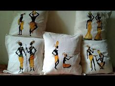 three decorative pillows on a bed with an image of people in yellow and black outfits