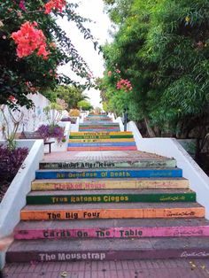 there are many colorful stairs painted with books