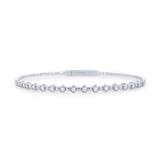 A clean, modern look crafted with a flexible design, this alternating bezel bangle features 0.50 carats of round brilliant cut diamonds. Modern Flexible Round Diamond Bracelet, Modern Stackable Diamond Bracelet, Modern Diamond White Bangle Bracelet, Modern Diamond Bracelet With Bezel Setting, Modern Diamond White Tennis Bangle Bracelet, Modern White Gold Diamond Bracelet With Bezel Setting, Modern Stackable Bangle Tennis Bracelet, Modern Round Cut Tennis Bracelet, Modern White Gold Bracelets With Bezel Setting