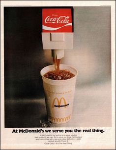 an advertisement for a mcdonald's drink with the caption at mcdonald's we serve you the real thing