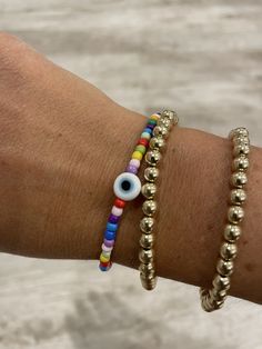 This listing is for one czech glass colorful beaded evil eye bracelet. Evil eye is white with blue center. Beaded will be multicolor.  To measure your wrist, measure snug and add 1/2 Inch.  It is recommended that to preserve the quality of this item, you do not wear this piece is water or right after applying lotions.  Please make yourself familiar with my shop policies before purchasing. Adjustable Multicolor Evil Eye Bracelet With Tiny Beads, Adjustable Multicolor Beaded Evil Eye Bracelet, Adjustable Evil Eye Beaded Bracelets For Everyday, Multicolor Beaded Evil Eye Bracelet Spiritual, Adjustable Multicolor Evil Eye Beads, Multicolor Beaded Evil Eye Bracelet, Adjustable Evil Eye Bracelet With Colorful Beads, Multicolor Evil Eye Bracelet With Colorful Round Beads, Bohemian Multicolor Evil Eye Bracelet With Tiny Beads