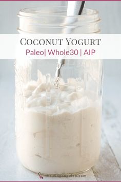 a jar filled with coconut yogurt sitting on top of a table