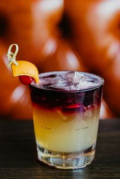 a drink with an orange slice on the rim