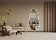 a modern living room with an oval shaped mirror on the wall and wooden flooring