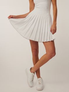 Women's Skirts: Leo Skirt Fitted White Tiered Skort, Fitted Tiered Skort With Elastic Waistband, White Fitted Skirt With Short Inseam, White Fitted Mini Skirt With Elastic Waistband, Sporty Fitted Tiered Skirt Skort, Sporty Fitted Tiered Skort, Fitted Sporty Tiered Skort, Sporty Stretch Bottoms With Pleated Hem, Spring Fitted Tennis Skirt