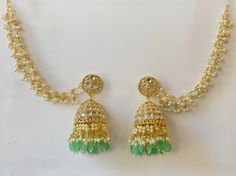 Bahubali Kundan Pearl Jhumka with sahare /Kundan Gold Jhumka/Indian/Pakistani/Punjabi/Statement earring/Bridal earring/Indian wedding Height = 82 mm || Width = 48 mm Bollywood Look Indo Western Earring Ships from California and delivery in 2-5 business days Can be paired with any dress Closure: Pushback This is 100% Handmade jewelry. So Color, shades, texture displayed may slightly vary from the actual product due to digital image limitations. We request you to consider these minor variations. P Bollywood Jhumkas With Latkans For Eid, Bollywood Style Jhumkas With Latkans For Eid, Bollywood Latkan Jhumkas For Eid, Eid Chandbali Jhumkas With Tilla, Bollywood Style Chandbalis With Latkans For Eid, Bollywood Lehenga Hand Set For Diwali, Bollywood Style Lehenga Hand Set For Diwali, Bollywood Style Lehenga For Diwali With Hand Set Details, Green Stone Work Jhumkas For Wedding