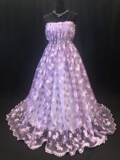 Beautiful Embroidery light Purple color lace with rhinestone beads. Eco- Friendly. Breathable. Good quality. Width 50”. Embellished Tulle Fabric For Evening, Party Gown With Floral Embroidery And Lace, Glamorous Embellished Net Dress, Embellished Lace Gown For Banquet, Embroidered Lace Prom Gown, Embroidered Lace Gown For Prom, Fitted Embroidered Net Dress, Embellished Net Dresses For Party, Net Embellished Dresses For Party