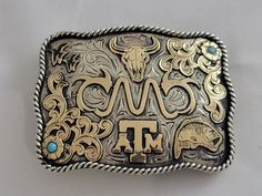 Texas A&M Aggies Belt Buckle. Custom Western Trophy Buckle.  CREATE YOUR OWN Custom Buckle. Any size and shape. All of our pieces are hand-made one at a time with special care for details. Add a custom logo, picture, animal, or figure. Hand-cut and hand-engraved German Silver Buckles. You can add up 3 lines of text, names, events, anniversary, wedding date, birth date, class reunion, company name, etc, etc. We can even engrave the back for you with the text of your choice. For custom buckles: 1) Class Reunion, Belt Style, Texas A&m, Saddle Leather, German Silver, Text Image, Anniversary Wedding, Belt Size, Custom Logo