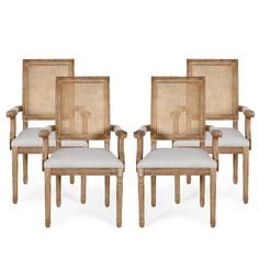 set of four chairs with cane back and upholstered seat cushions in natural wood