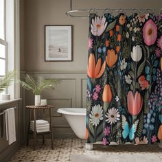 a bathroom with a bathtub, shower curtain and rug in the shape of flowers