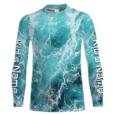 a long sleeved shirt with the words ocean waves printed on it