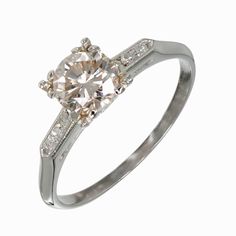 a white gold ring with diamonds on it