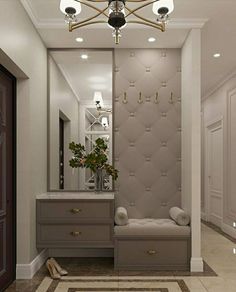 a bathroom with a vanity, mirror and two lights on the ceiling over it's sink