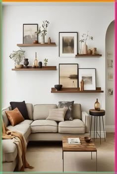 a living room filled with lots of furniture and pictures on the wall above it's shelves