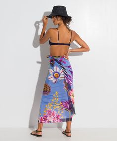 Go beyond the beach with this investment-worthy style in a stunning botanic print and elevated fabric that drapes beautifully! A sarong scarf (also known as a pareo) is a classic summer cover-up that is the epitome of versatility. Worn casual or chic, this beach-ready essential can be a dress, a skirt, or a scarf. Dimensions: 42" x 70" Materials: 80% cotton / 20% silk Made in: India ​ Tropical Wrap Sarong For Vacation, Tropical Style Wrap Sarong For Vacation, Bohemian Sarong With Tropical Print For Beach Season, Floral Print Wrap Beachwear Cover-up, Summer Beach Sarong With Vibrant Print, Bohemian Tropical Print Sarong For Pool, Vibrant Print Sarong For Summer Vacation, Summer Pool Sarong With Tropical Print, Tropical Style Wrap Sarong For Beach Season