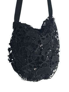 "Skull Hobo Bag Skull Black Crossbody Bag Black Sequin Skull Handbag Goth Hobo Bag Skull Goth Handbag Skull Lace Pouch Gothic Handbag Purse LARGE HOBO BAG Approximate Measurements: 20\" wide across the top X 15\" high 7-8\" wide gathered bottom Fully-lined in black cotton quilted fabric Interior pockets Center magnetic closure Black nylon webbing strap MINI HOBO Approximate Measurements: 12\" wide across the top X 10\" high 4\" wide gathered bottom Fully-lined in black satin Center magnetic clos Black Gothic Tote Shoulder Bag, Black Skull Bag For Halloween, Black Skull-shaped Bag For Halloween, Black Shoulder Bag With Removable Pouch For Festival, Black Gothic Party Bags, Black Pouch Shoulder Bag For Festivals, Black Bags With Removable Pouch For Festival, Gothic Black Shoulder Bag For Festivals, Black Crossbody Hobo Bag For Party