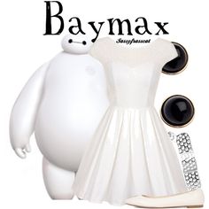 a white dress with black buttons and an earring next to a white teddy bear