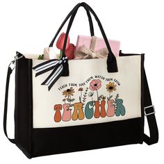 a black and white tote bag with the words teacher printed on it's side