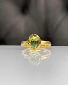 Natural Peridot Ring * Dainty Cabachon Ring * Genuine Peridot & 14K Solid Gold * Best Gift for Her/Him * Handmade Ring ◎ Details ◎ ○ Gemstone Details .Natural PERIDOT Oval Cut 9X7 mm approx. 2.01 ct ○ Gold Details 14K Solid Gold Width of Band : 2.50 mm Weight of Ring : approx 3.80 gr Made to Order HANDMADE ITEM ○ Upgrade to Solid 18K Gold, please click the link below: https://www.etsy.com/listing/962826004 For more CABACHON BEZEL rings : http://etsy.me/37fvI60 ○ PERIDOT RINGS : https://etsy. Gold Sapphire Ring Oval Cabochon With Polished Finish, Heirloom Gold Emerald Ring With Oval Cabochon, Oval Gemstone Dome Ring In Yellow Gold, Gold Dome Cabochon Ring In 14k Gold, Timeless Gold Dome Ring With Cabochon, 14k Yellow Gold Dome Ring With Oval Cabochon, Classic Yellow Gold Sapphire Ring Oval Cabochon, Gold Oval Dome Ring With Cabochon, Yellow Gold Domed Gemstone Ring