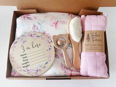 Our Baby Gift Boxes come with the cutest gifts for every newborn. Each box includes: - Premium Ultra soft sherpa blanket - Wooden Birth Annoucement Disc - Wooden Baby Rattle - Wooden Baby Brush - Super soft Muslin Swaddle - Gift Box Rattle is display item only and not to be used as a toy. Keep out of the hands of children. Wooden Baby Rattle, Birth Announcement Gifts, Photo Frame Ornaments, Christmas Photo Frame, Baby Gift Box, Muslin Swaddle, Lunch Box Bag, Ornament Frame, Personalized Towels