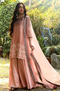 Pink kurta with floral embroidered motifs and scallop border. Paired with pant and a bandhani printed motifs and organza dupatta.
Component: 3
Embroidered
Neckline: Round
Sleeve Length: Three quarter
Fabric: Heavy Chanderi, Heavy Modal, Organza
Color: Pink
Sheer dupatta - Aza Fashions Velvet Kurta, Pink Kurta, Garden Embroidery, Kurta Set For Women, Pant For Women, Blossom Garden, New Address, Sleeves Designs For Dresses, Organza Dupatta