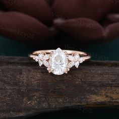 Pear shaped moissanite engagement ring Rose gold butterfly engagement ring Vintage marquise diamond cluster ring Art deco bridal gift ● Ring information: --main stone: moissanite --stone size & shaped: 6*8mm & pear cut --side stones: moissanite/diamond 0.25ct ● Optional service: --personalized order --rush order & overnight --installment --engraving --gift box Please consult us for details ● Production and shipping time: We usually make the ring and arrange the delivery within 7 days, the logist Pear Shaped Cluster Engagement Ring, Moissanite Ring Pear, Engagement Ring Butterfly, Marquise Rings Engagement, Pear Engagement Ring Diamond, Pear Cut Ring Engagement, Pear Engagement Rings Vintage, Engagement Pear Rings, Moissanite Engagement Ring Pear