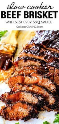 slow cooker beef brisket with bbq sauce on a white plate and garnished with parsley