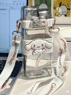 a clear bag with a cartoon dog on it sitting in front of a laptop computer