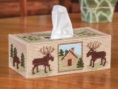 a tissue box that has some animals on it