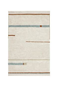 a white rug with brown, blue and grey stripes on the bottom half of it