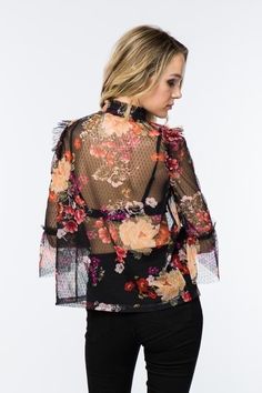 Timing Fashion Sheer mesh floral blouse, ruffled shoulder and elbow accented with bell. 3/4 sleeves. High shirred collar. No cami or lining included.Color: Black Multi Sizes: S-M-L Bust 36-38-40, Length 23100% Polyester, hand wash, imported M2/MT21115 Fitted Spring Blouse With Mesh Sleeves, Chic Spring Tops With Mesh Sleeves, Elegant Floral Print Stretch Blouse, Long Sleeve Floral Print Top For Party, Spring Party Blouse With Ruffle Sleeves, Elegant Stretch Floral Print Blouse, Chic Spring Blouse With Mesh Sleeves, Spring Chic Blouse With Mesh Sleeves, Fitted Blouse With Floral Print And Ruffle Sleeves